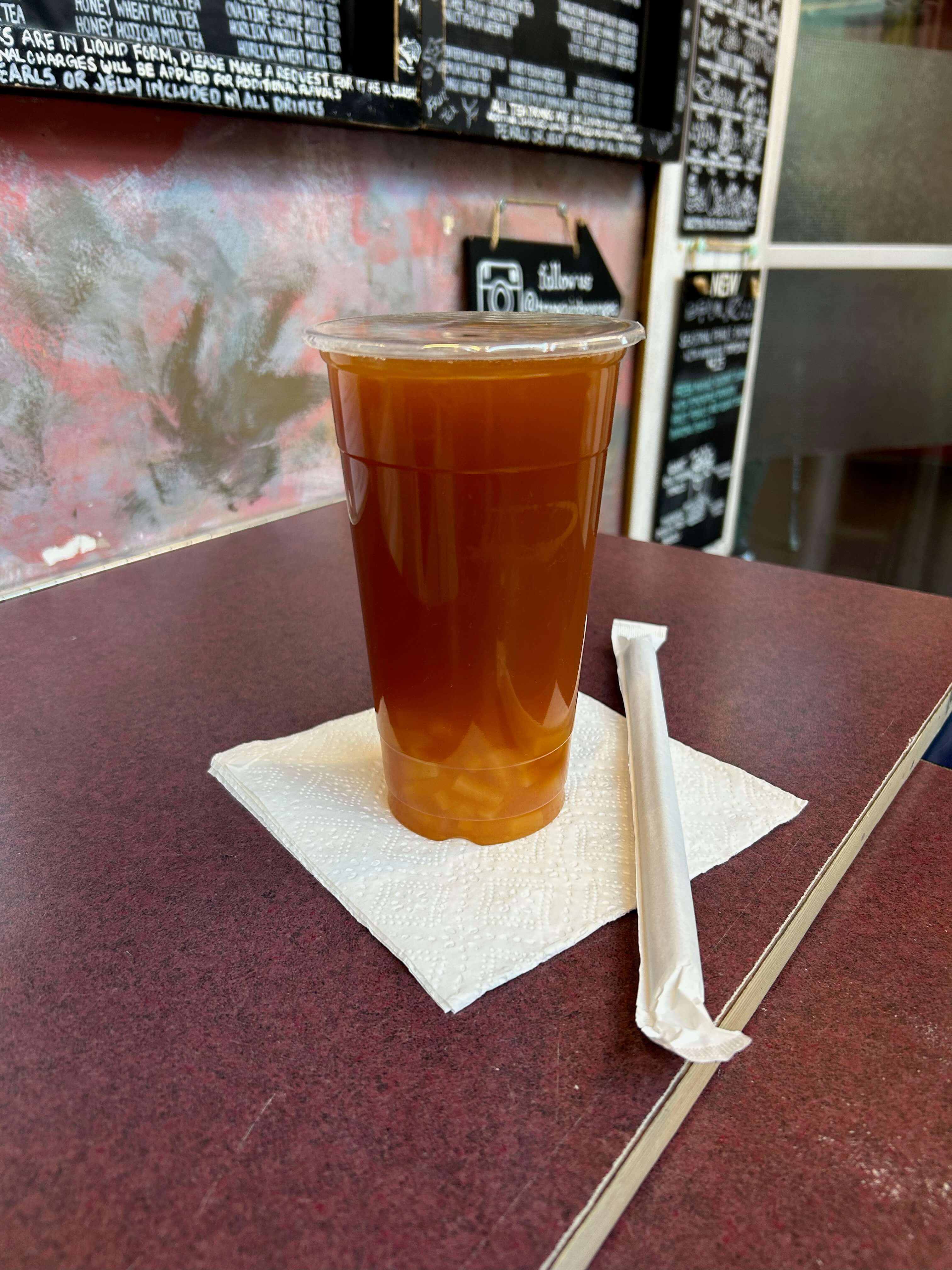 Mango peach passionfruit green tea with passionfruit jelly