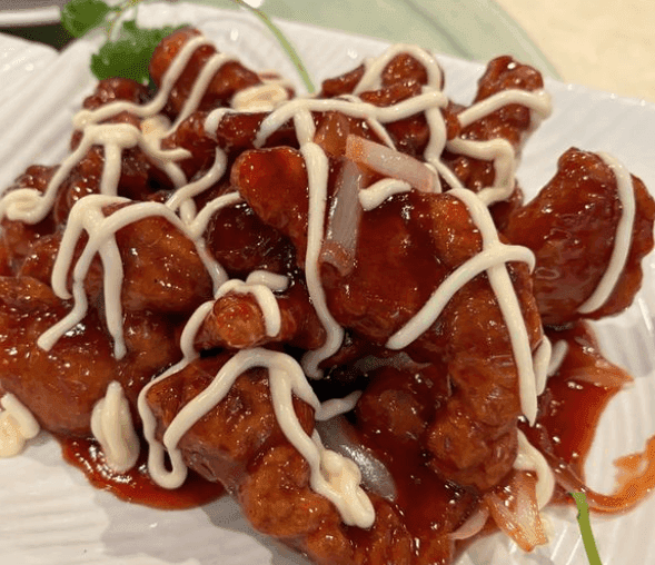 Peking Style Pork Chop topped with mayo